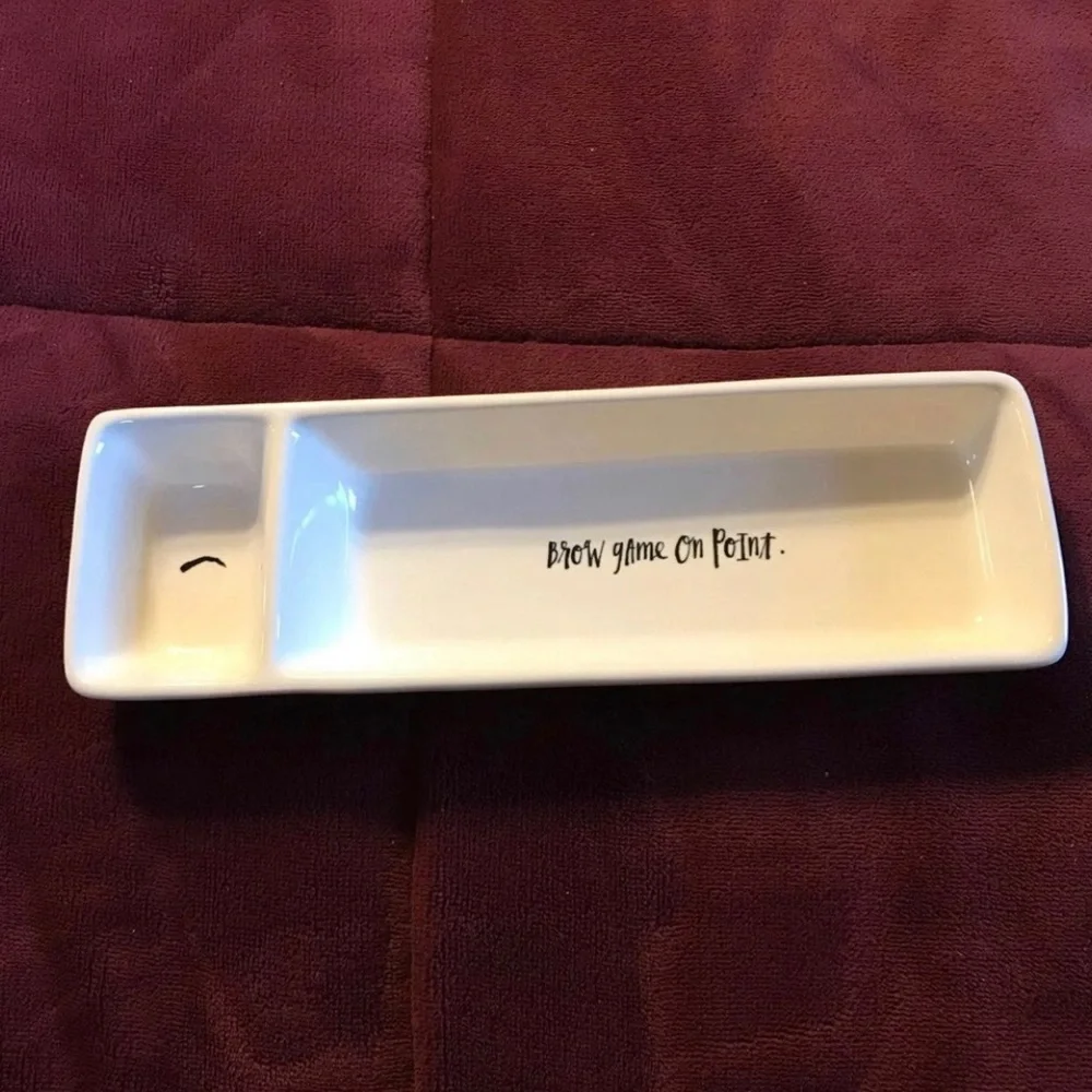 Rae Dunn Ceramic Makeup Tray “brow game on point”.